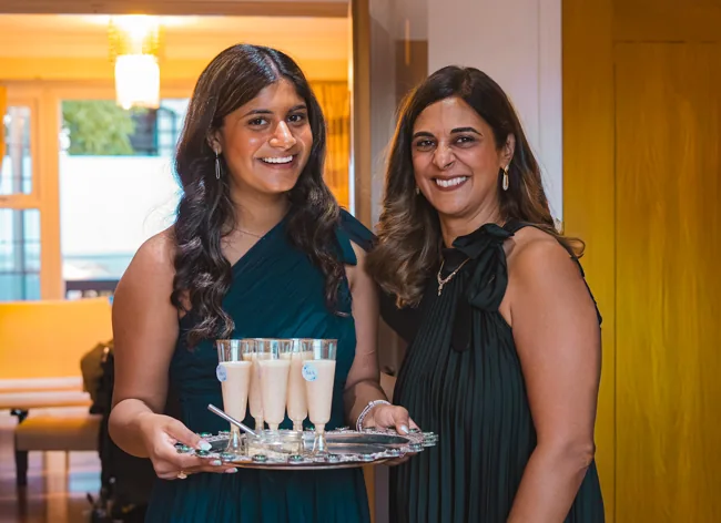 Two guests together at a celebration.
